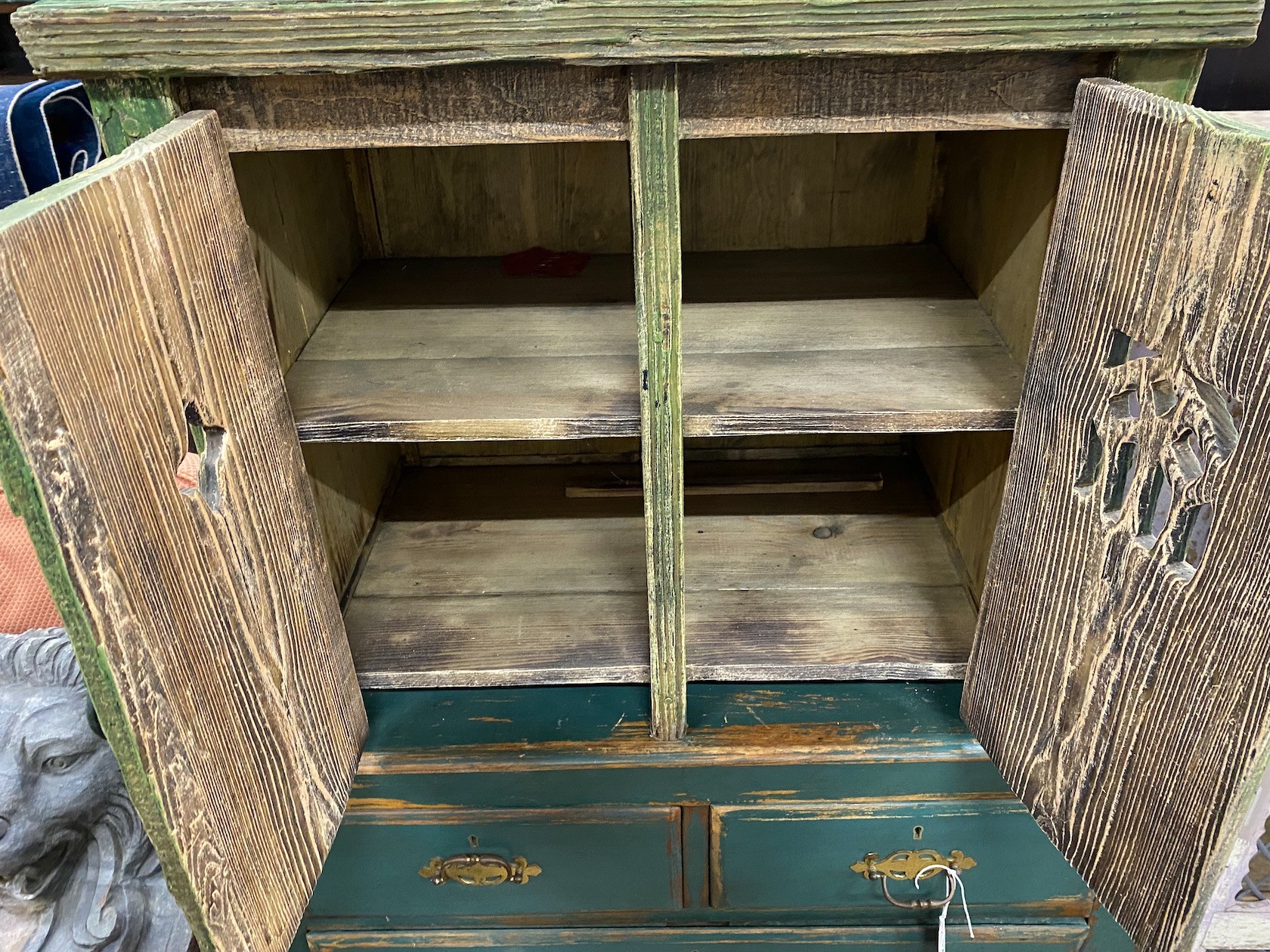 A small Gothic style painted pine two door cupboard, width 66cm, depth 41cm, height 57cm